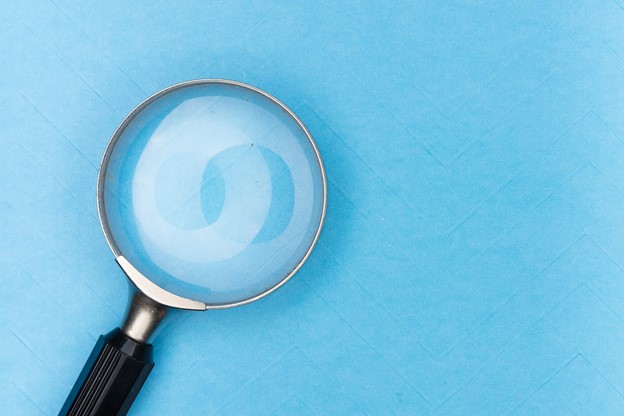 magnifying glass on white table magnifying glass on white table